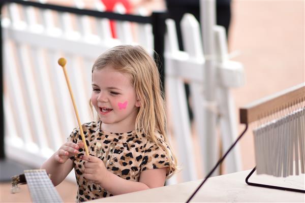  Child playing instrument